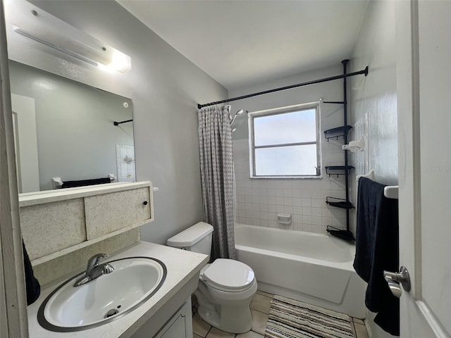 full bathroom featuring tile patterned floors, vanity, toilet, and shower / bathtub combination with curtain