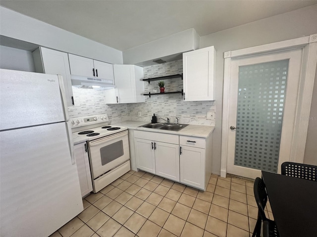 kitchen featuring decorative backsplash, white cabinetry, sink, and white appliances