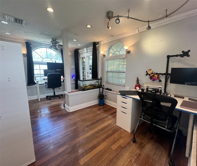 office area with a textured ceiling, dark hardwood / wood-style floors, ceiling fan, and a healthy amount of sunlight