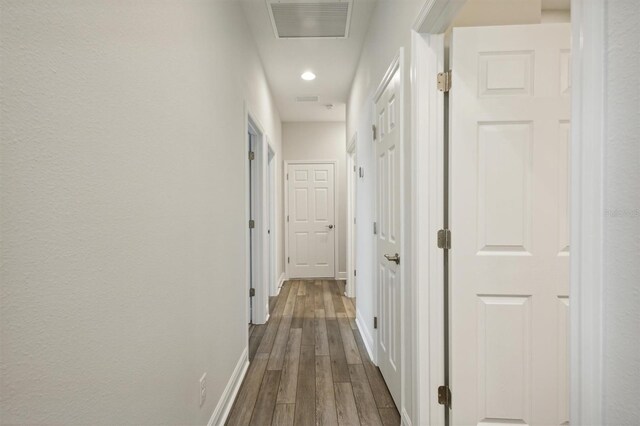 hallway featuring hardwood / wood-style floors