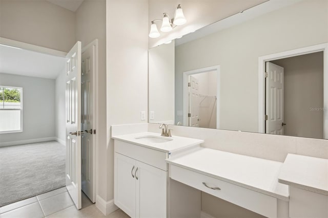 full bath featuring tile patterned floors, a spacious closet, baseboards, and vanity