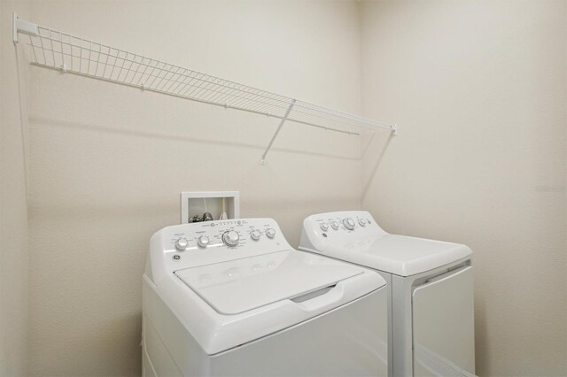 washroom with separate washer and dryer