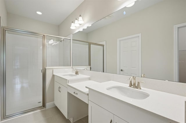 bathroom with dual vanity, tile patterned flooring, and a shower with shower door