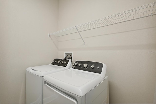 laundry room with washer and clothes dryer