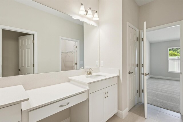 bathroom with vanity and tile patterned flooring