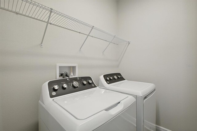 laundry room featuring separate washer and dryer