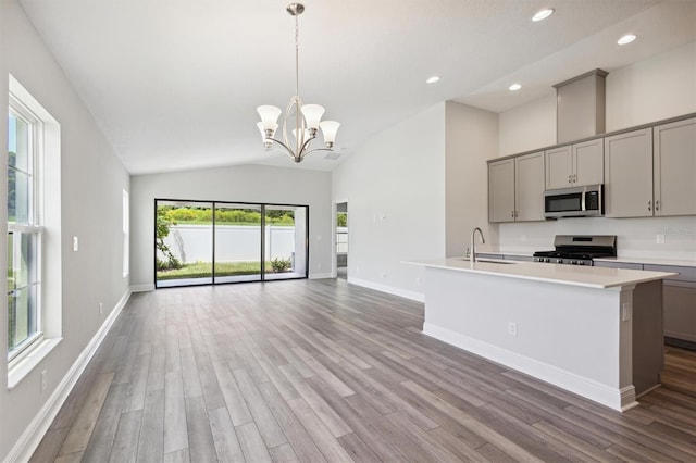 kitchen featuring a sink, stainless steel appliances, gray cabinets, and light countertops