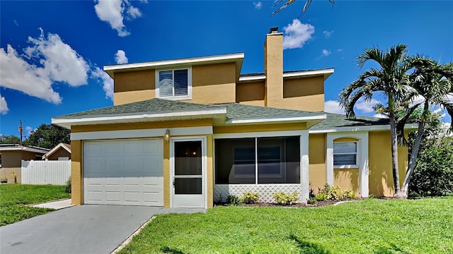 view of front of property featuring driveway, a garage, stucco siding, fence, and a front yard