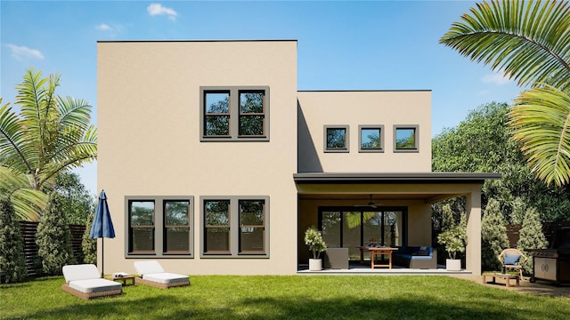 back of house with stucco siding, ceiling fan, outdoor lounge area, and a yard