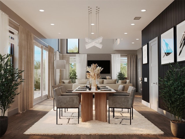 dining area featuring wood finished floors and recessed lighting