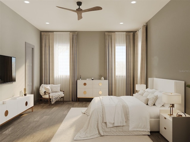 bedroom featuring a ceiling fan, recessed lighting, and wood finished floors