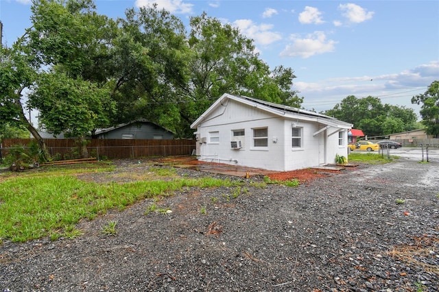 view of side of property featuring cooling unit