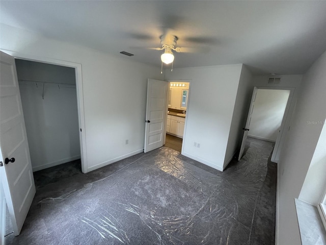 unfurnished bedroom featuring baseboards, visible vents, ceiling fan, and a closet