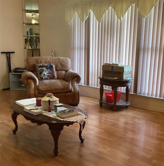 sitting room with hardwood / wood-style flooring