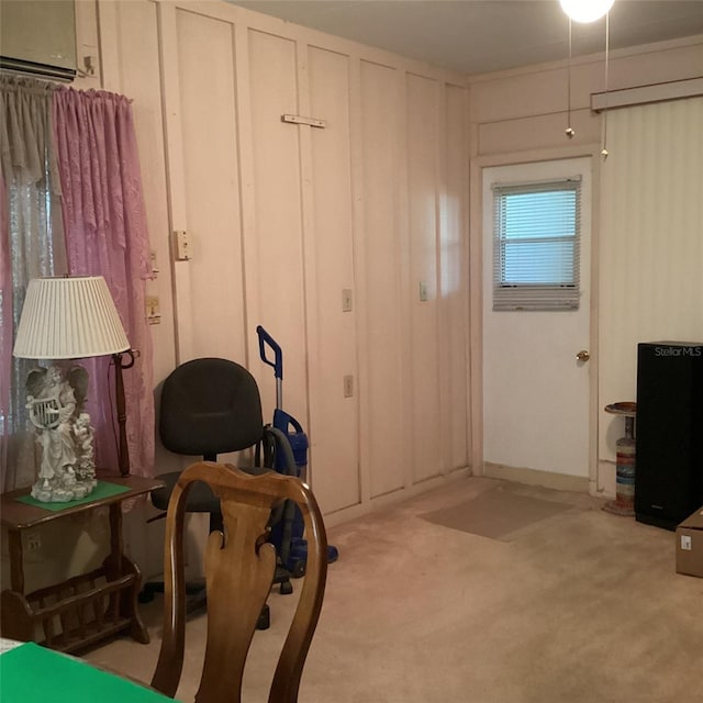 interior space featuring light colored carpet and a wall unit AC