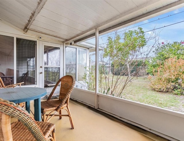 sunroom / solarium with vaulted ceiling