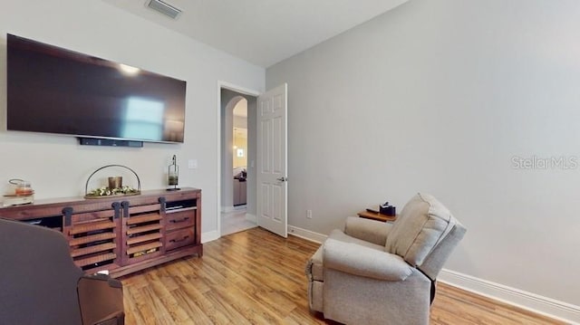 sitting room featuring light hardwood / wood-style floors