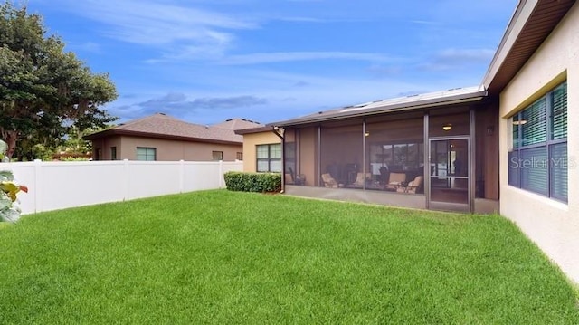 view of yard with a sunroom