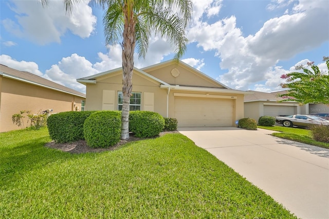 view of front of property with a garage and a front lawn