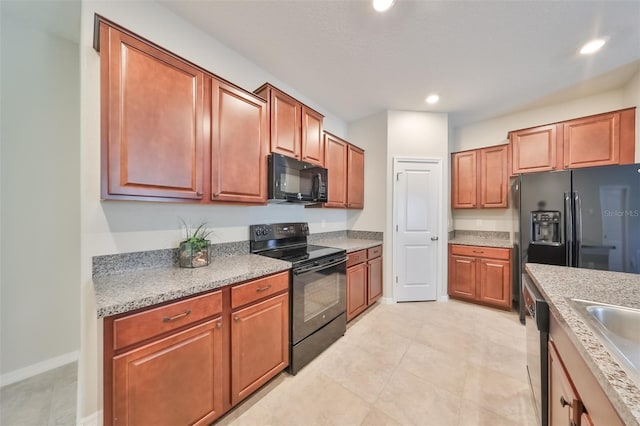 kitchen featuring sink and black appliances