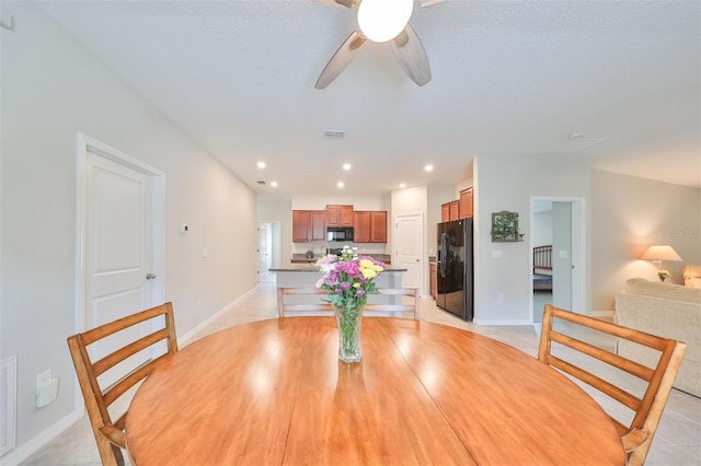 dining room featuring ceiling fan