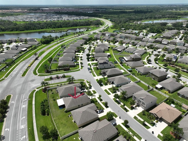 drone / aerial view with a water view