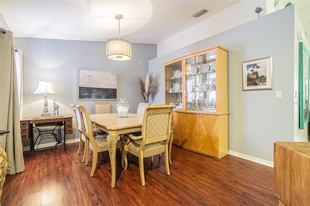 dining room featuring dark wood-type flooring