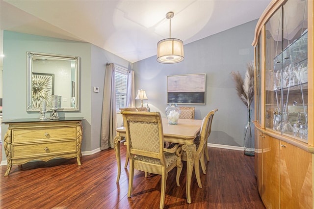 dining space with dark hardwood / wood-style flooring