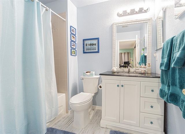 full bathroom featuring vanity, toilet, and shower / bathtub combination with curtain