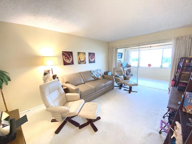 carpeted living room featuring a textured ceiling