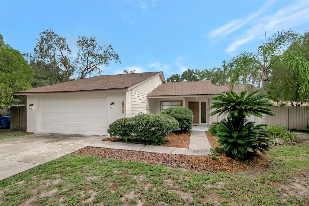 ranch-style home featuring a garage