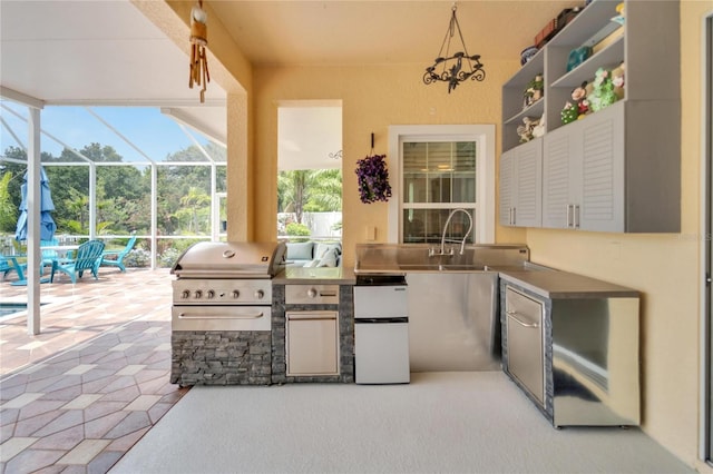 19300 Lonesome Pine Dr, Land O Lakes, FL 34638 - view of patio with a sink, an outdoor kitchen, a lanai, and a grill