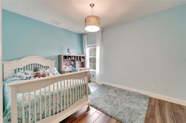 19300 Lonesome Pine Dr, Land O Lakes, FL 34638 - bedroom featuring baseboards and wood finished floors