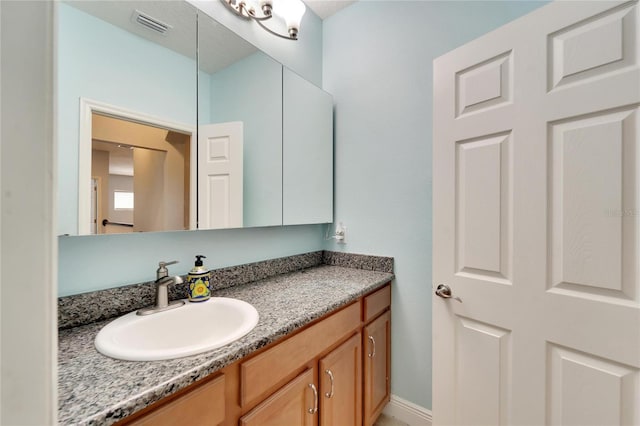 19300 Lonesome Pine Dr, Land O Lakes, FL 34638 - bathroom featuring visible vents and vanity