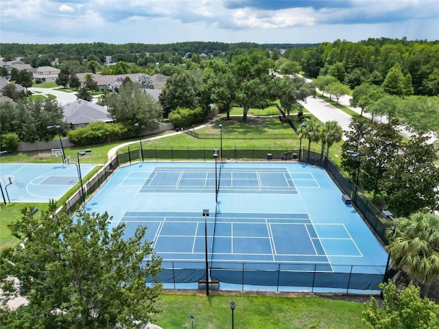 19300 Lonesome Pine Dr, Land O Lakes, FL 34638 - view of tennis court featuring a lawn and fence