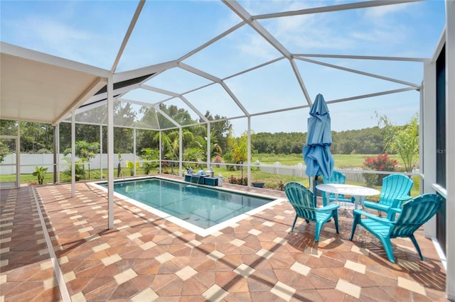 19300 Lonesome Pine Dr, Land O Lakes, FL 34638 - view of swimming pool featuring glass enclosure, a patio area, fence, and a fenced in pool