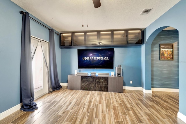 19300 Lonesome Pine Dr, Land O Lakes, FL 34638 - bar with baseboards, visible vents, a ceiling fan, wood tiled floor, and a textured ceiling