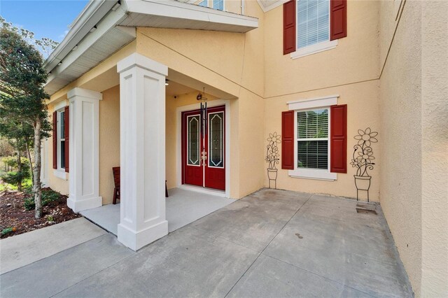19300 Lonesome Pine Dr, Land O Lakes, FL 34638 - doorway to property with stucco siding