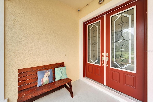 19300 Lonesome Pine Dr, Land O Lakes, FL 34638 - view of exterior entry featuring stucco siding