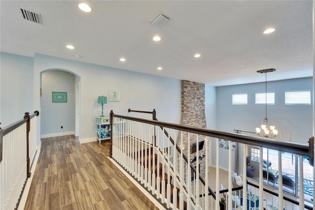 19300 Lonesome Pine Dr, Land O Lakes, FL 34638 - hall featuring a chandelier, an upstairs landing, and visible vents