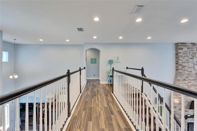 19300 Lonesome Pine Dr, Land O Lakes, FL 34638 - hall with recessed lighting, visible vents, an upstairs landing, and wood finished floors