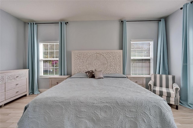 19300 Lonesome Pine Dr, Land O Lakes, FL 34638 - bedroom with multiple windows and wood finished floors