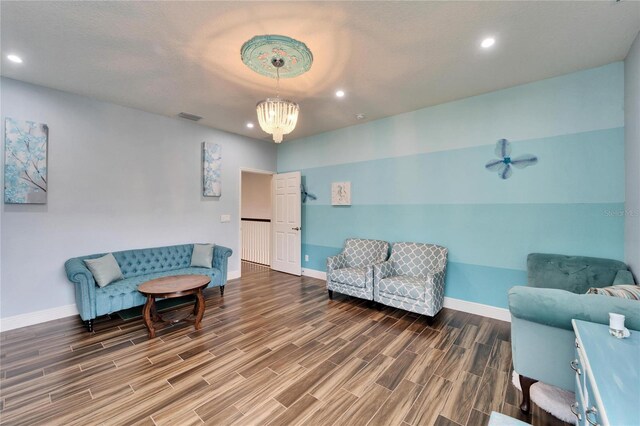 19300 Lonesome Pine Dr, Land O Lakes, FL 34638 - living area with baseboards, visible vents, wood finish floors, a notable chandelier, and recessed lighting