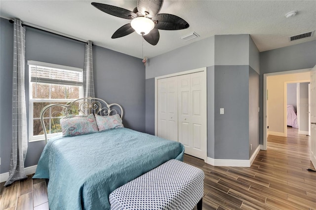 19300 Lonesome Pine Dr, Land O Lakes, FL 34638 - bedroom featuring wood tiled floor, visible vents, and baseboards