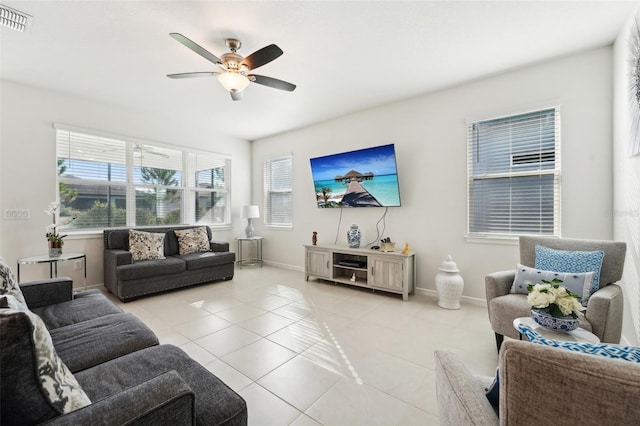 tiled living room with ceiling fan