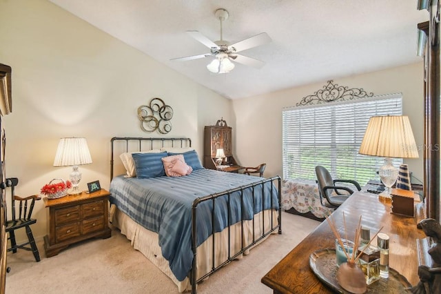 bedroom with light carpet, ceiling fan, and vaulted ceiling