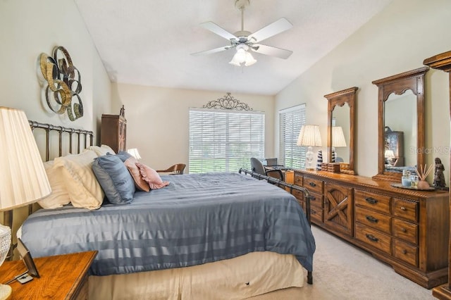 bedroom with light carpet, ceiling fan, and vaulted ceiling