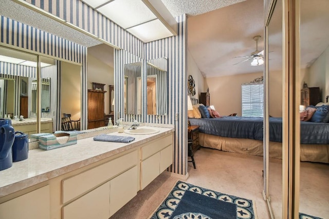 bathroom with vanity and ceiling fan