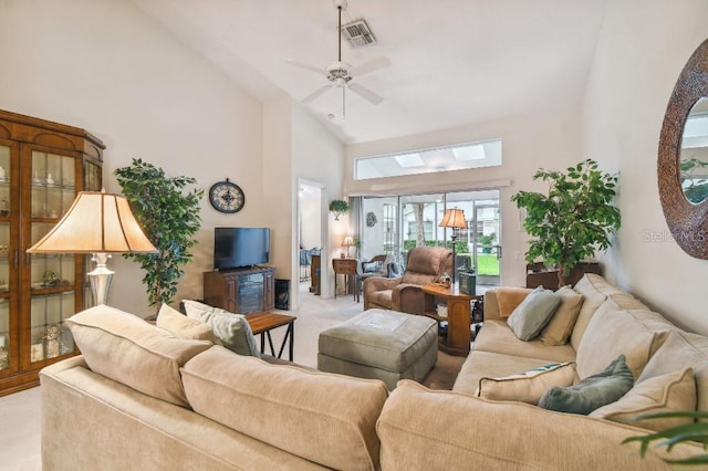 carpeted living room featuring ceiling fan and high vaulted ceiling