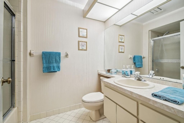 bathroom featuring vanity, tile patterned floors, and toilet